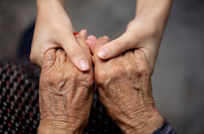 2 pairs of hands holding