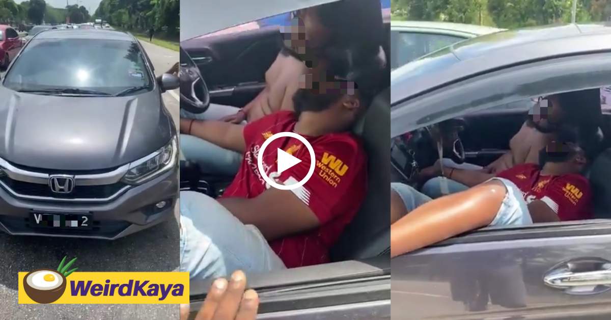 Two men believed to be drunk obstruct traffic while passed out cold in the car