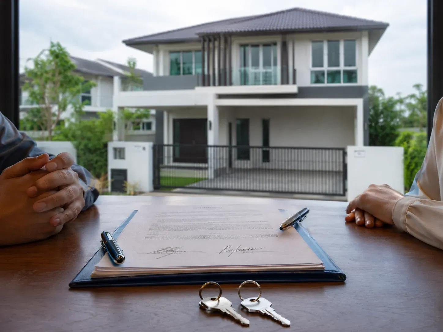 wk contract signing with new home view