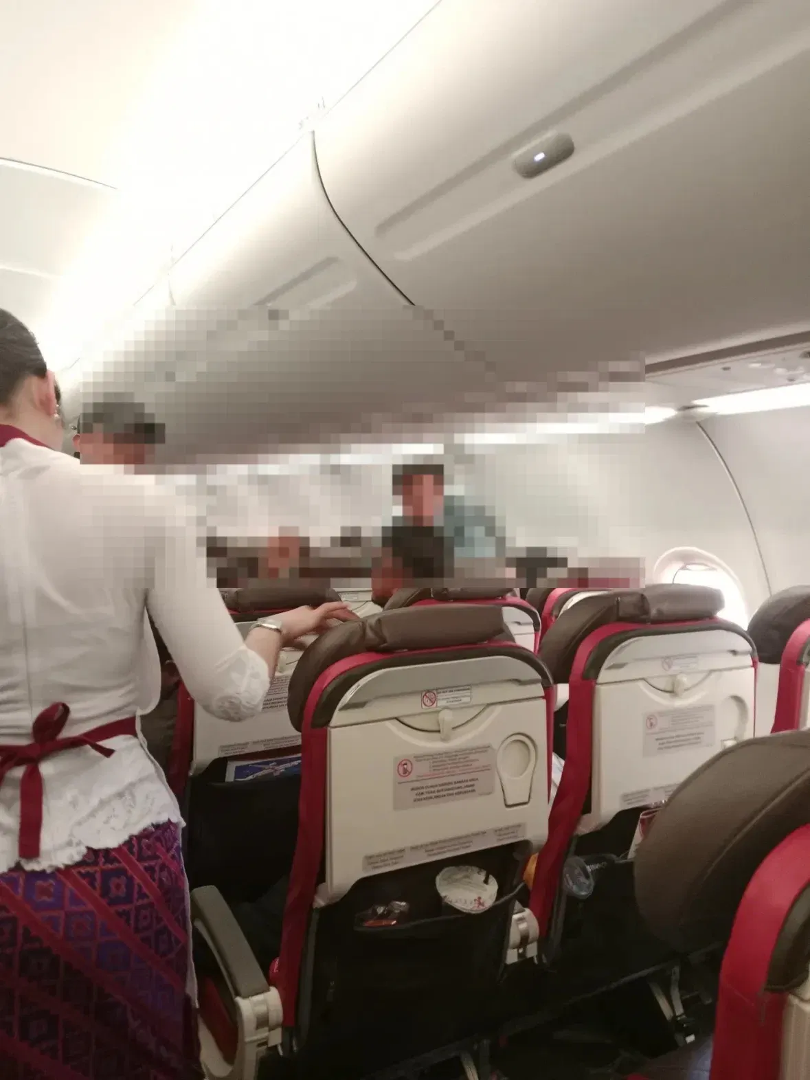 wk passenger from china allegedly ignores crew warning before power bank catches fire mid flight..