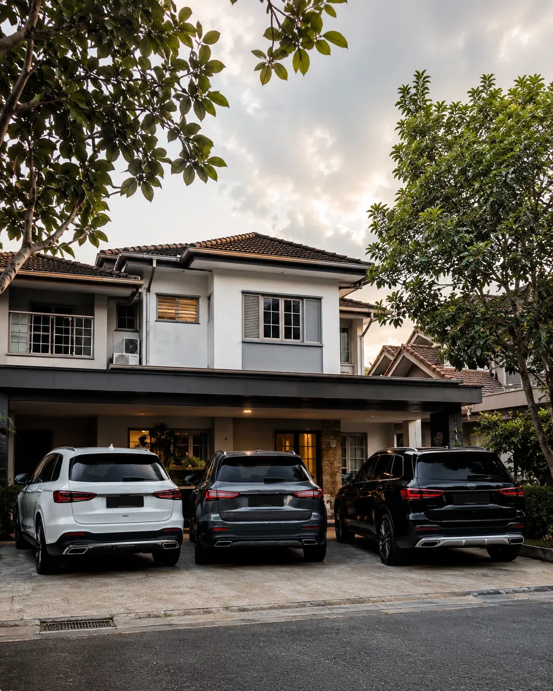 wk three suvs before a modern home