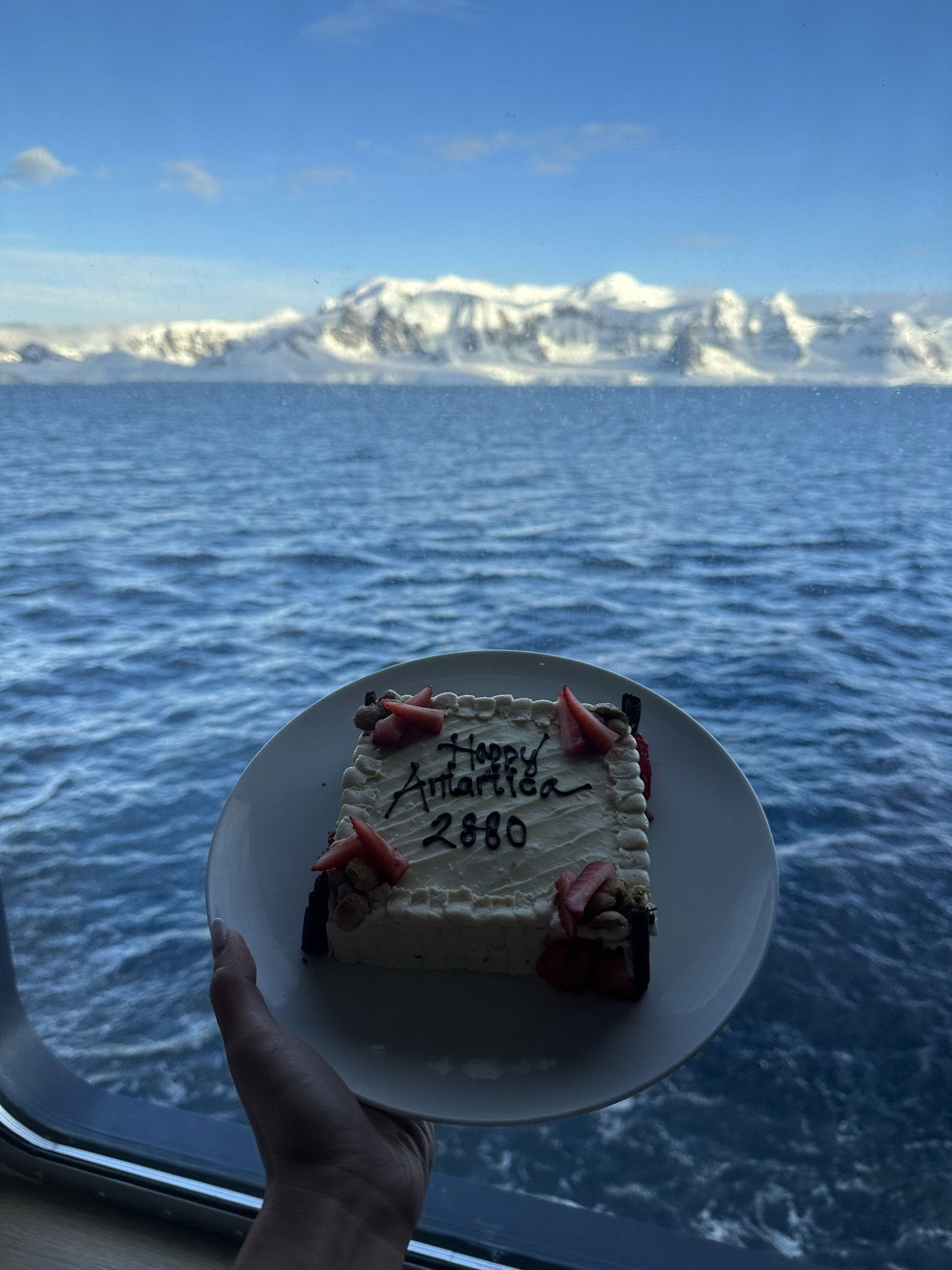 Antarctica — Celebrating her 28th birthday and 80th country with a “2880” cake