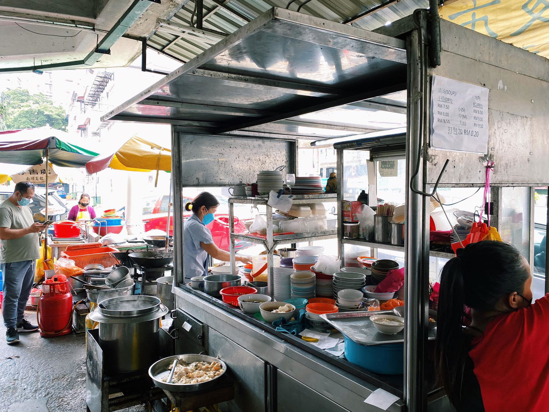 Auntie preparing meals at 168 Wantan Mee