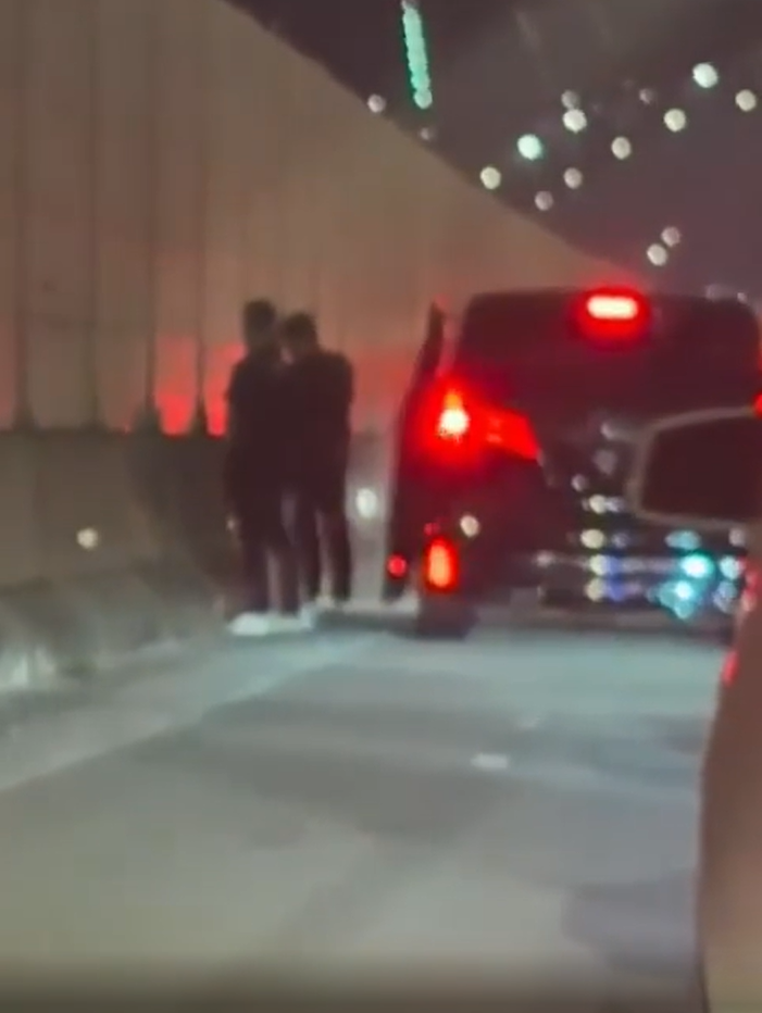 Men pee on EDL Highway (1)