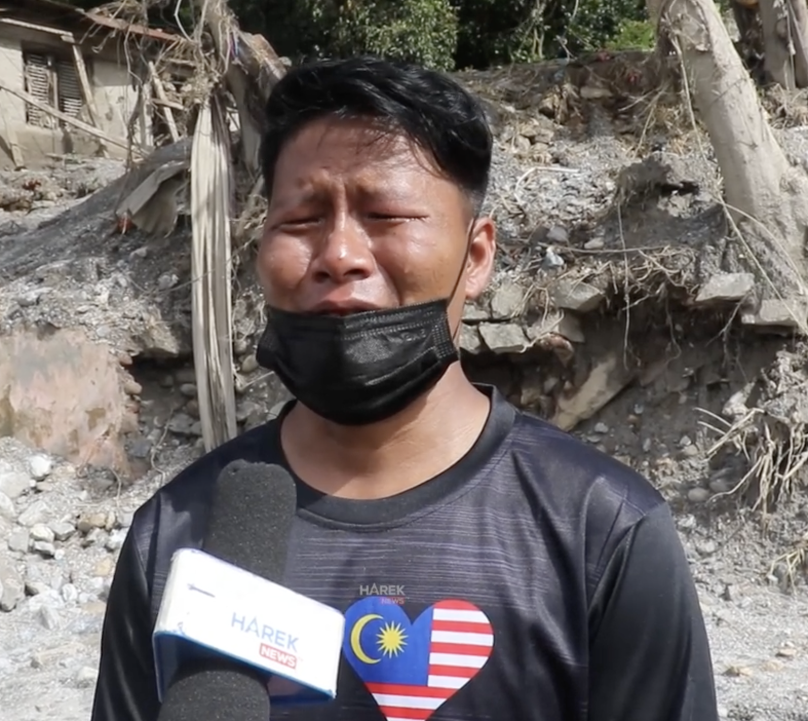 Nepali man crying can't find wife and daughter