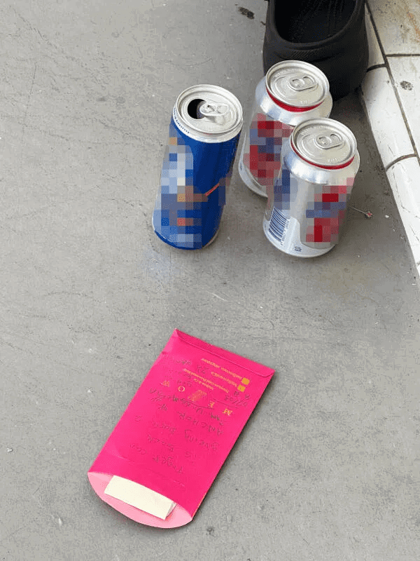 Alcohol and red packet left in front of Toa Payoh flat