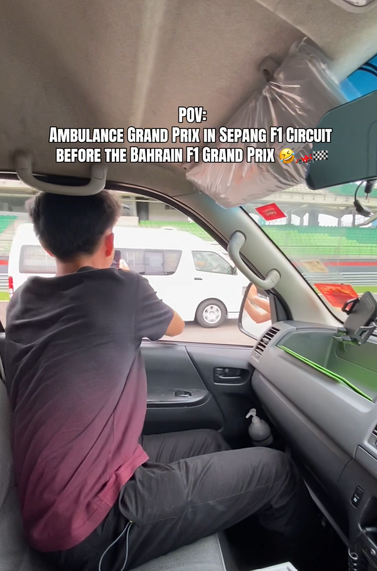 ambulance and car racing at sepang circuit