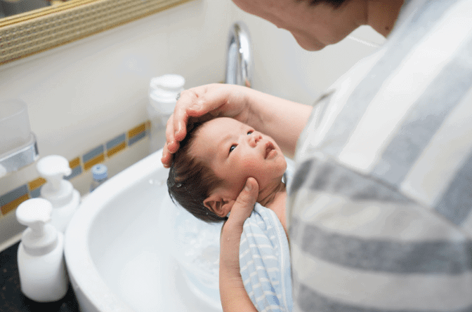 Asian woman holding a baby