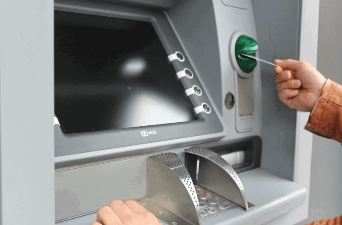Man using ATM card