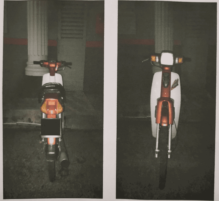 red Honda Ex-5 motorcycle