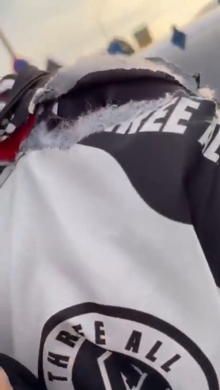 biker strangled kite string slashes neck clothes