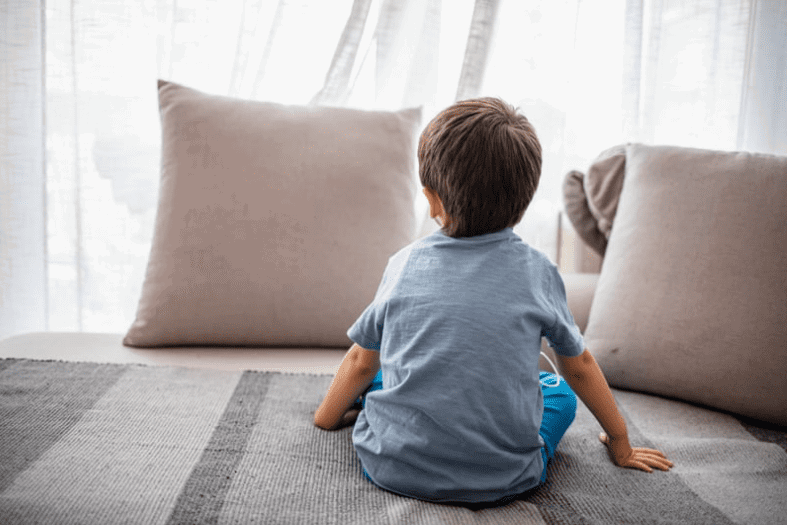 boy alone at home