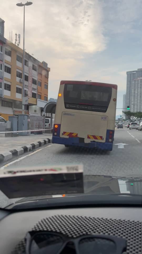 bus stopping at bus stop at gombak