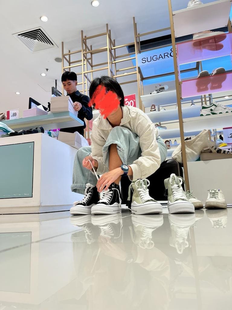 Author's sister buying shoes
