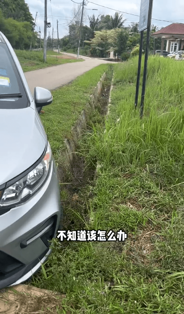Car stuck in drain