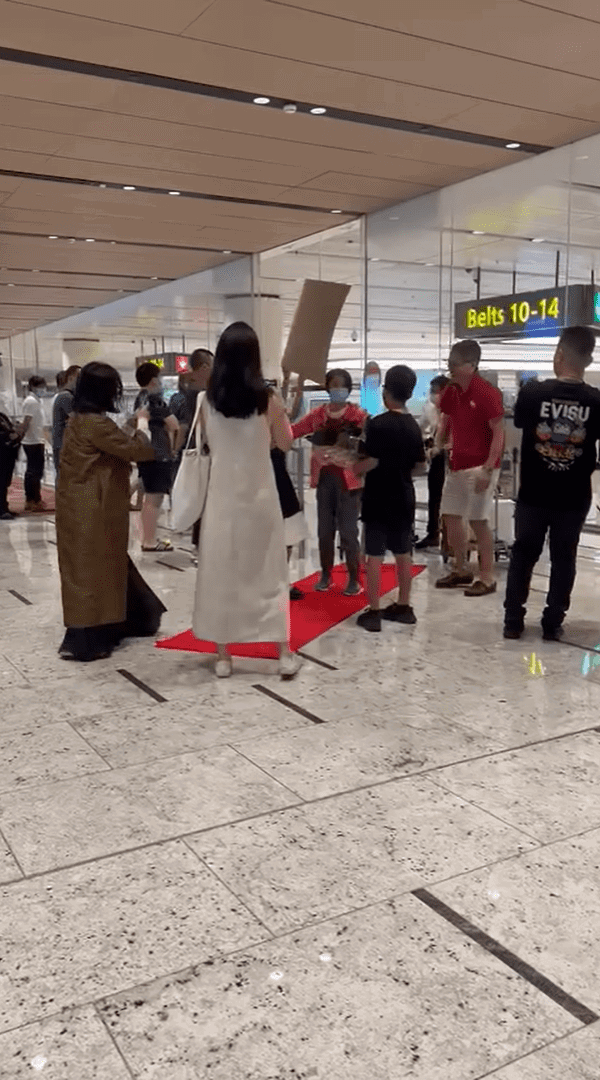 Family welcomes grandma at Changi Airport