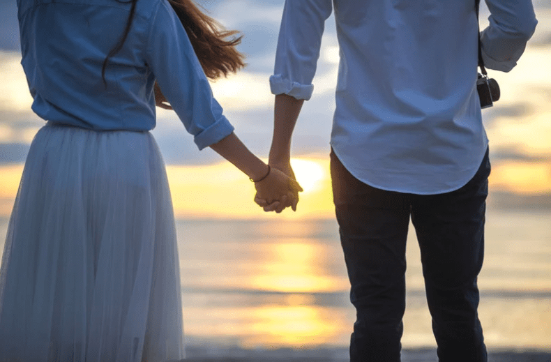 Couple holding hands