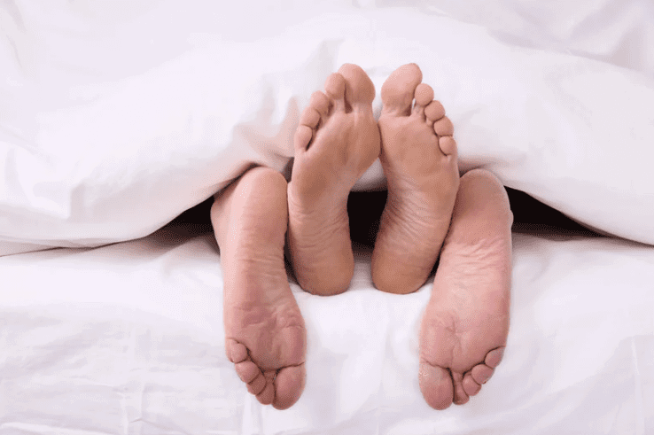 Couple sleeping in bed