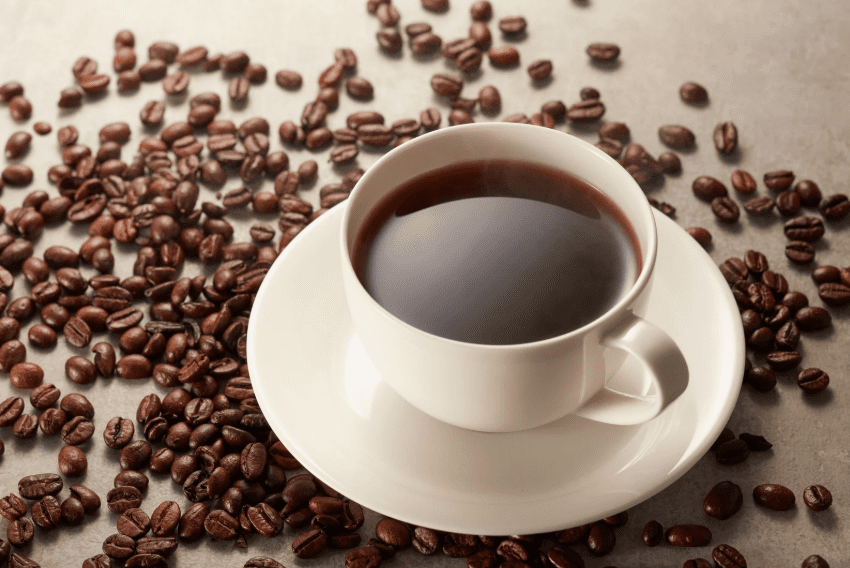 cup of coffee with beans