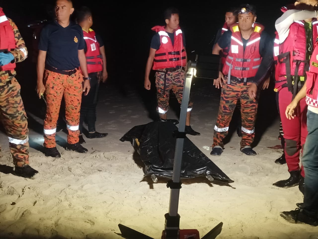 firemen with a dead body found drowned in port dickson