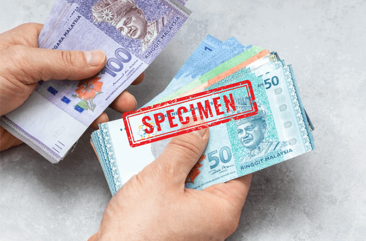 Hands holding Ringgit