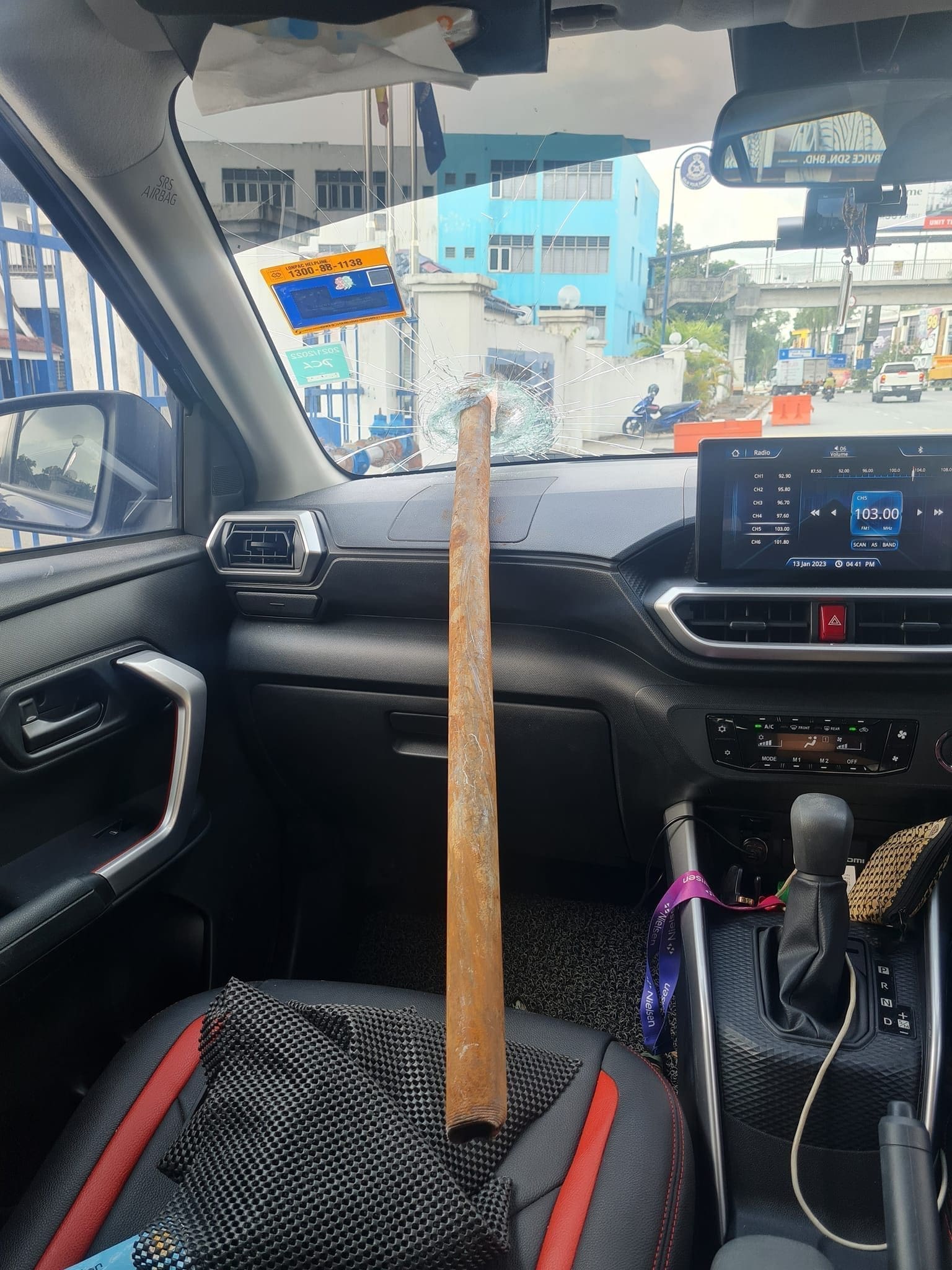 metal rod pierces through windshield