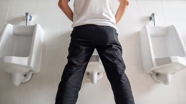Man peeing in a toilet