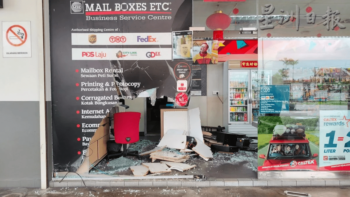 Aftermath of car crash at Ipoh petrol station