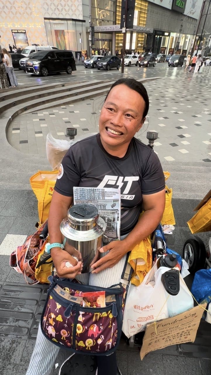 Koh Lee Peng smiles