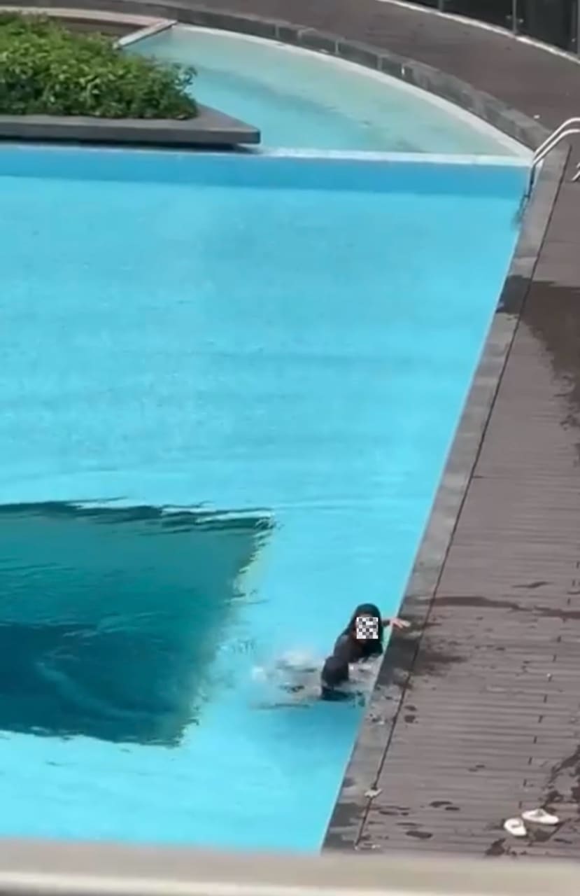 GF in the water arguing with her BF
