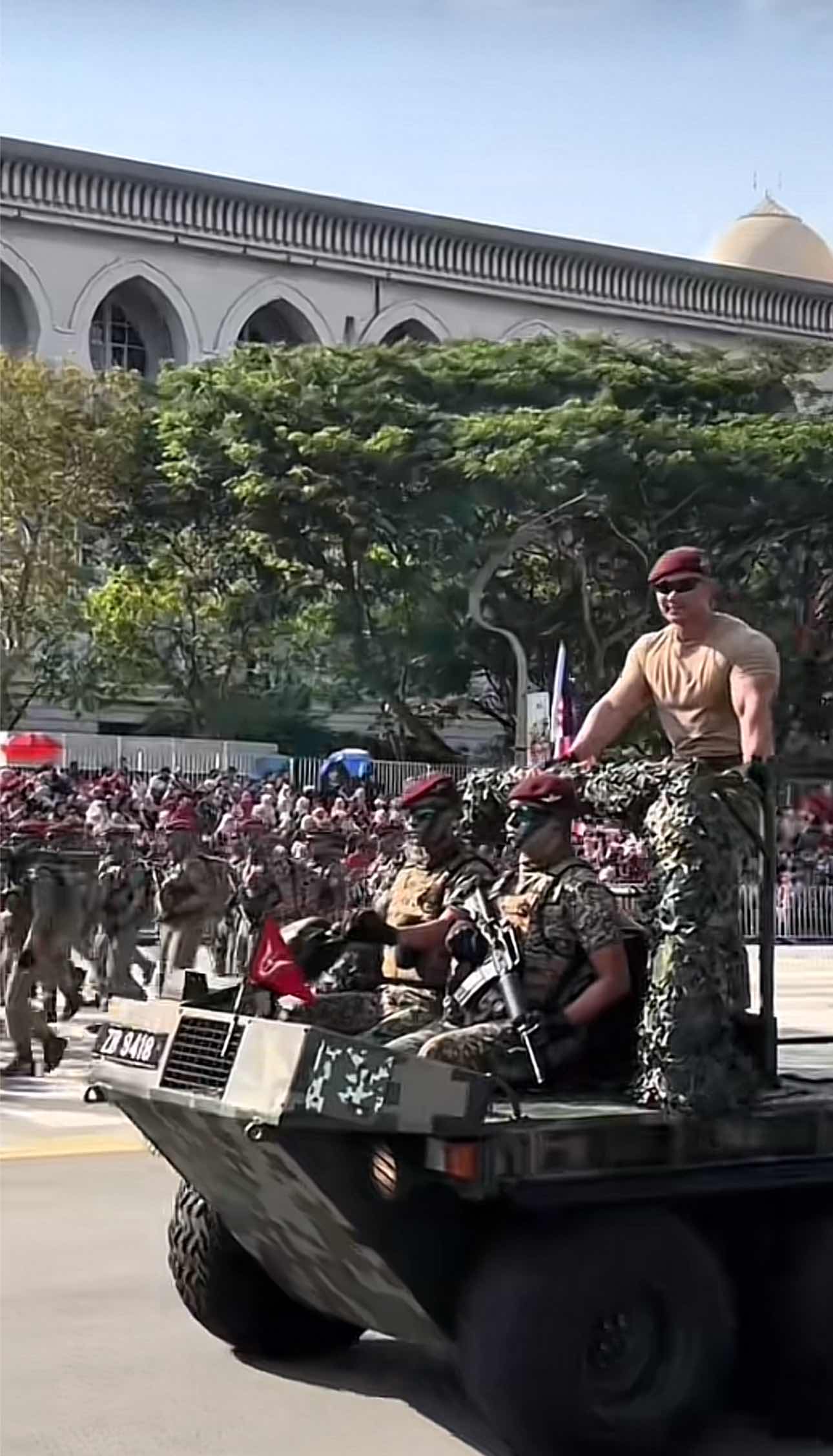 Abang Askar waving