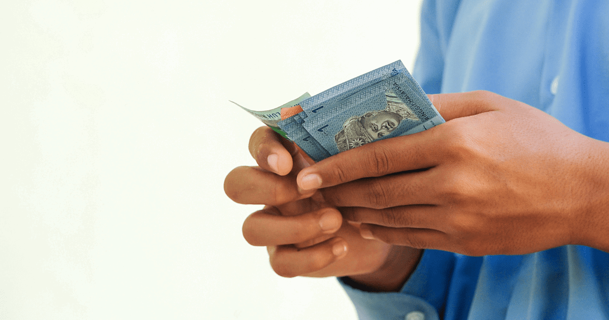 ringgit notes in hand