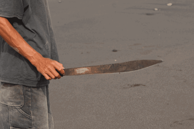 man holding a parang