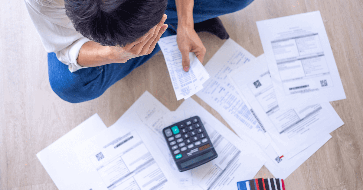 man is calculating his bills
