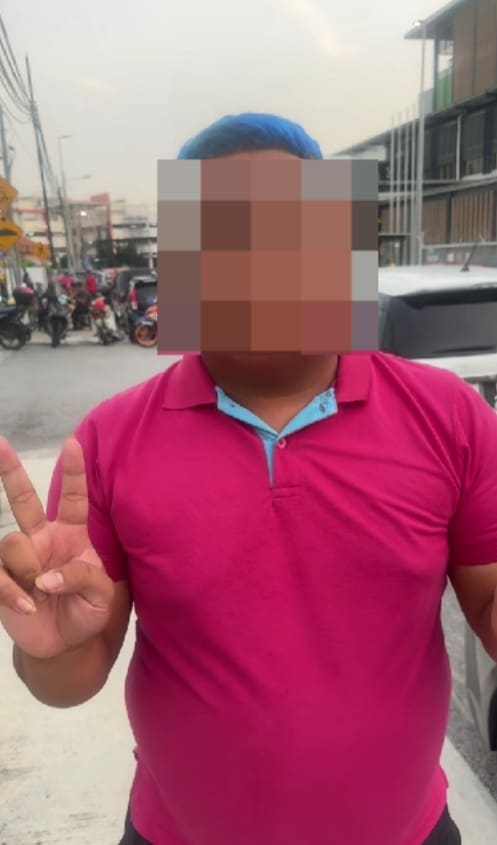 man showing peace sign