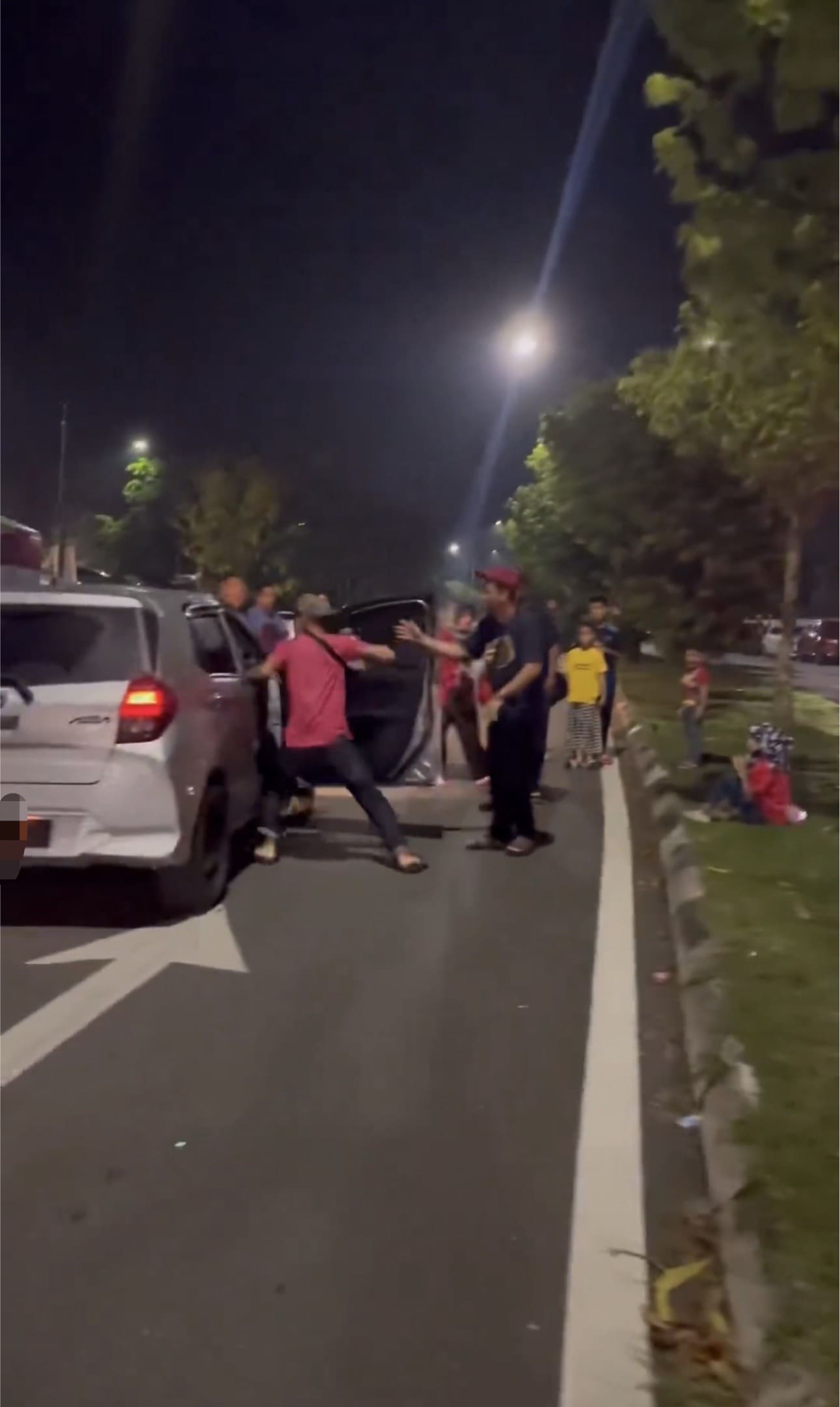 Man throwing a hard punch at the driver once again