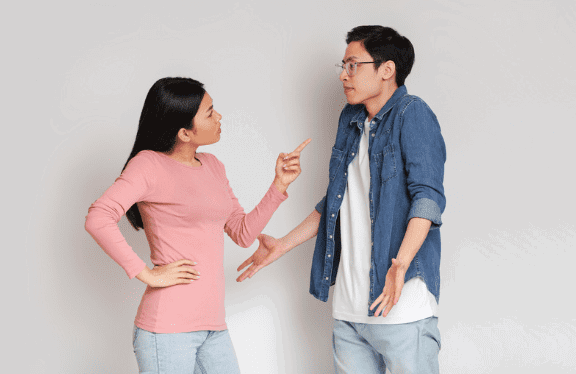 Asian mum scolding her son