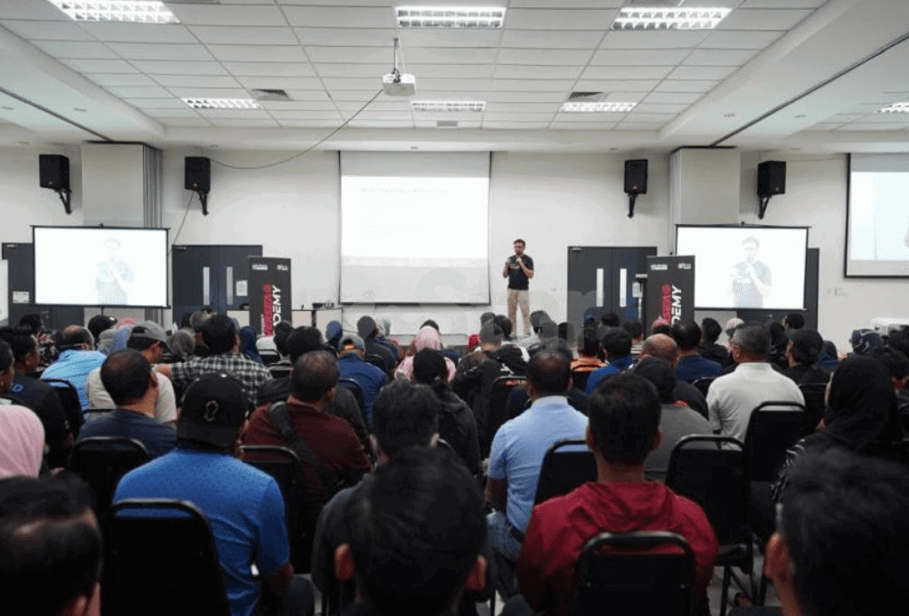 Msian lecturer giving talk to students