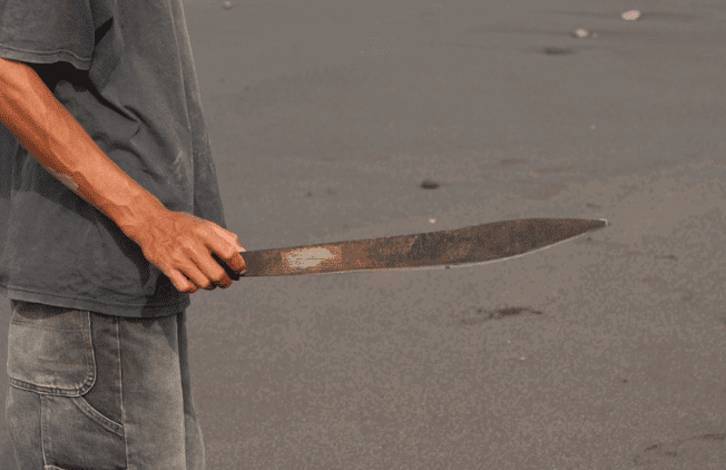 Man holding parang