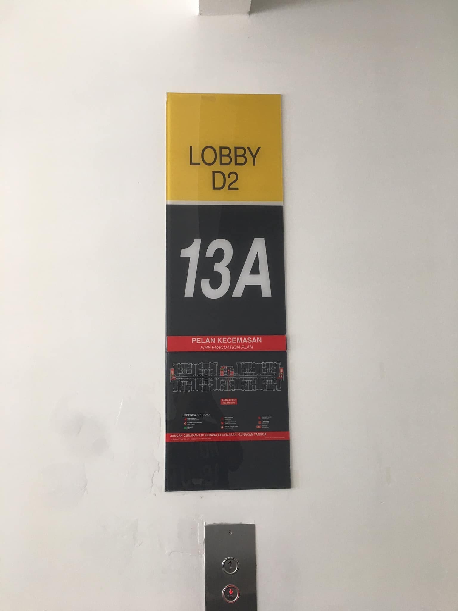 Building signboard showing 14th floor as 13A