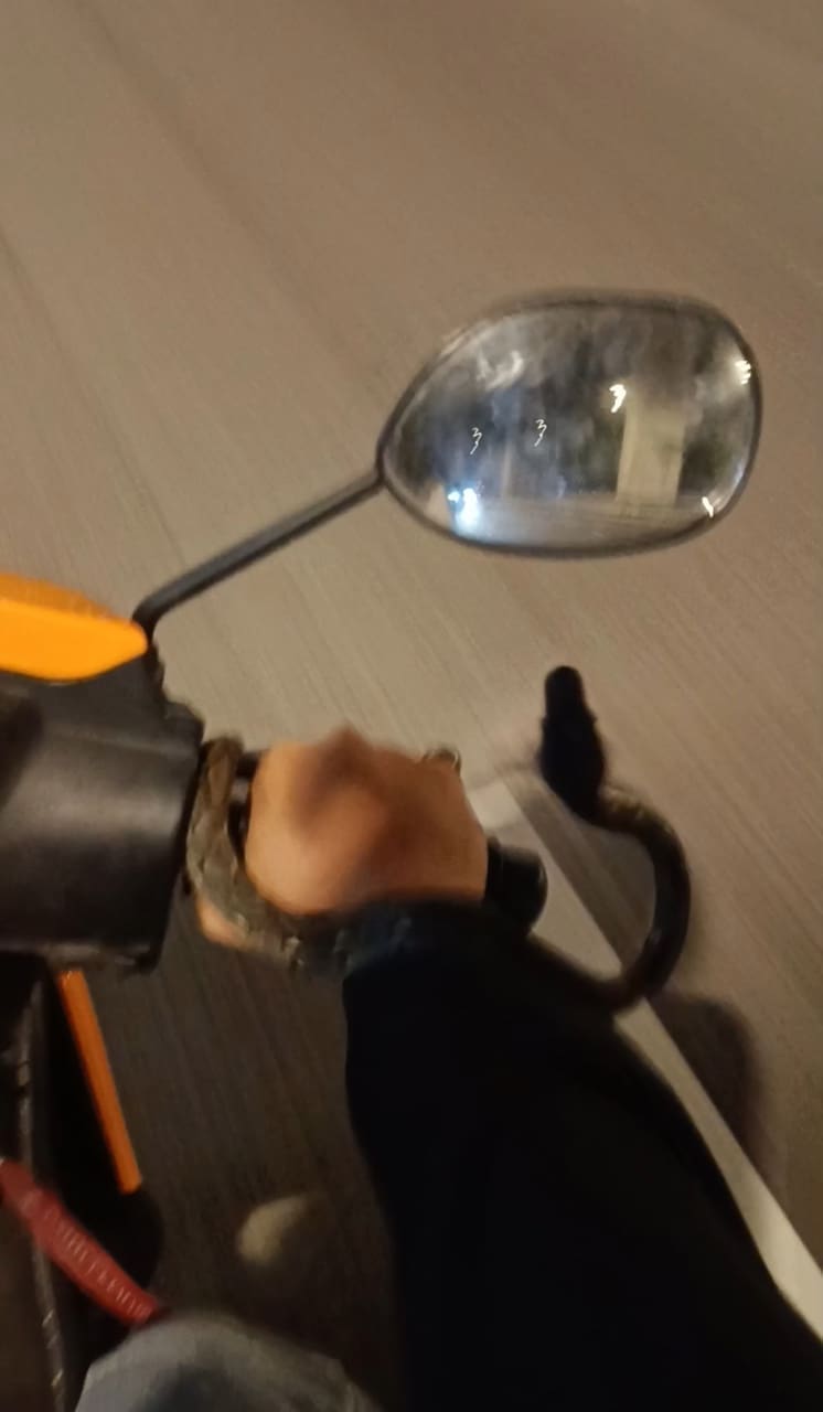 snake on the hand of msian motorcyclist