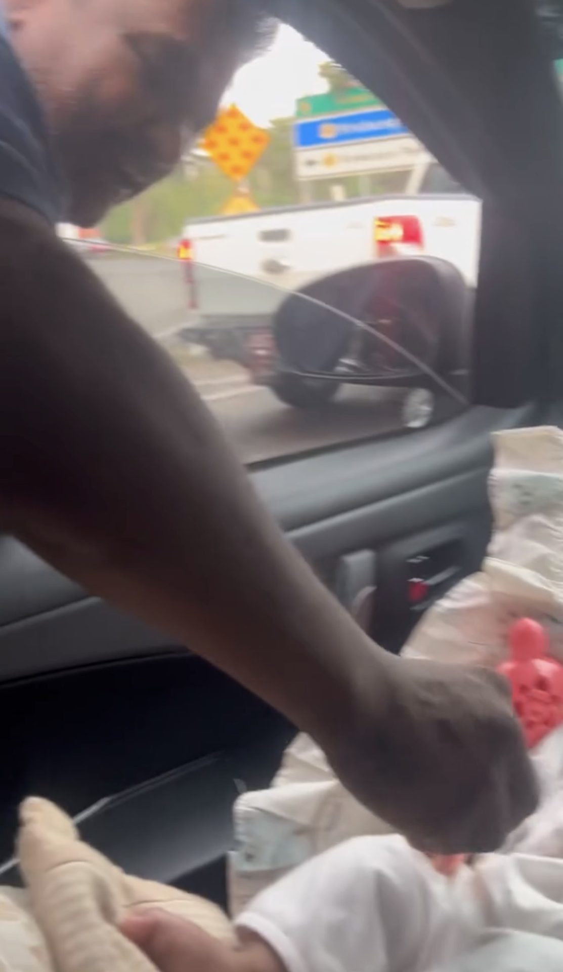 uncle giving cash to baby