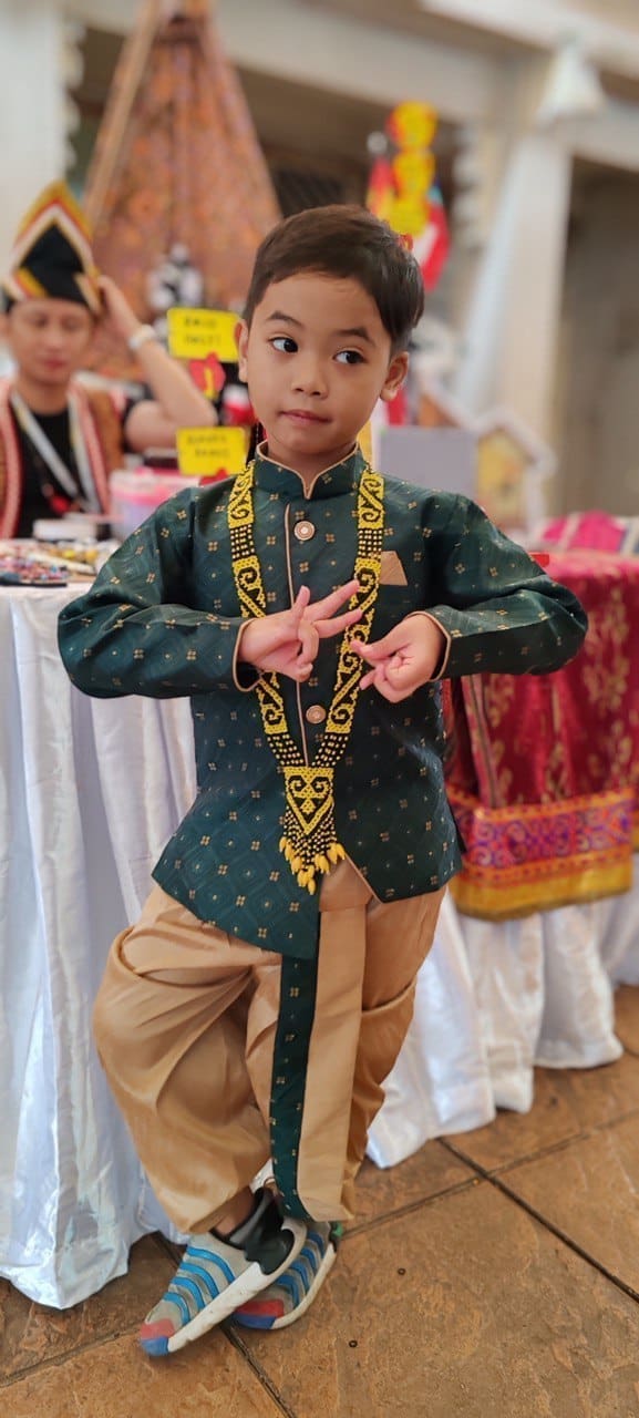 6-year-old Malaysian boy, Muhammad Nurhaq wearing in traditional attire while in posing Bharatanatyam pose.