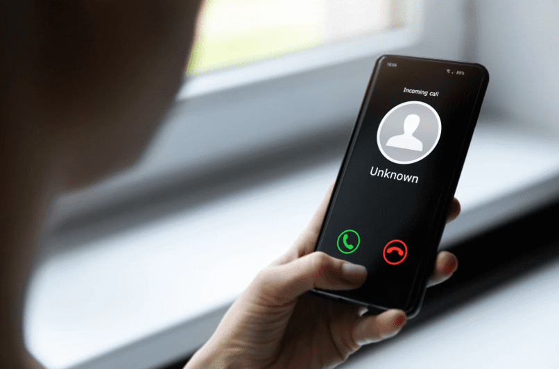 Woman getting a call from an unknown number