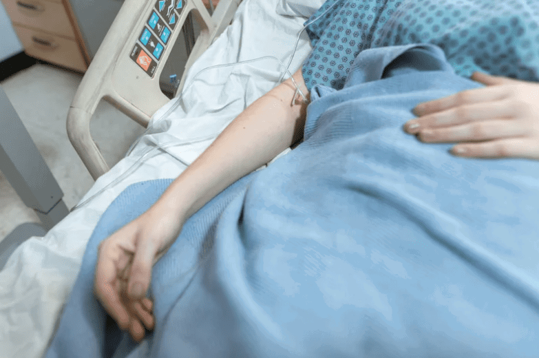 Woman on hospital bed