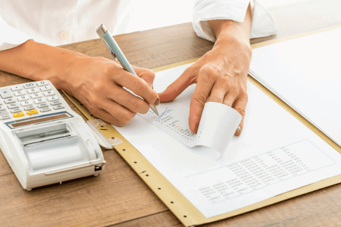 Man issuing a paper receipt