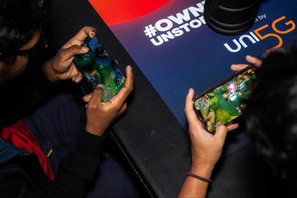 men playing phone in their phone