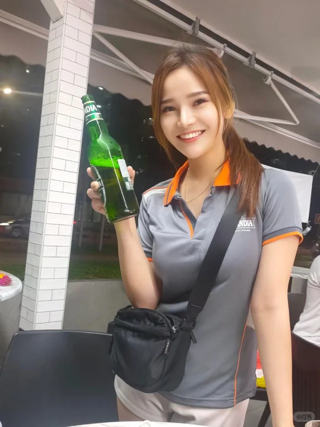 Xinyi with a beer bottle