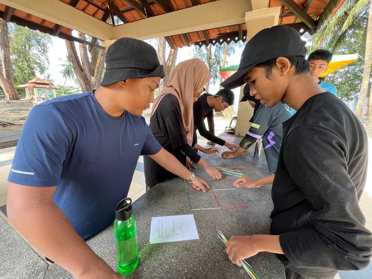 2 - Leadership program participants demonstrating the power of teamwork in action
