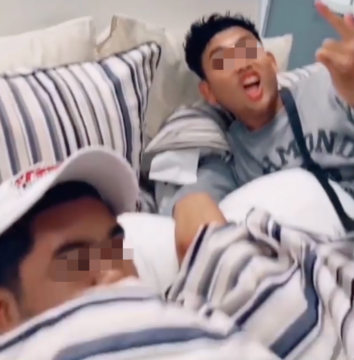 2 maskless men allegedly caught sleeping on a bed in ikea penang. Jpg